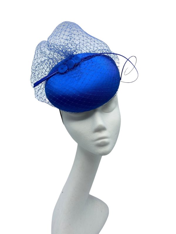 Stunning versatile blue headpiece with veiled base and matching blue quill detail.